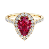 Pear shaped ruby and french pave diamond ring.