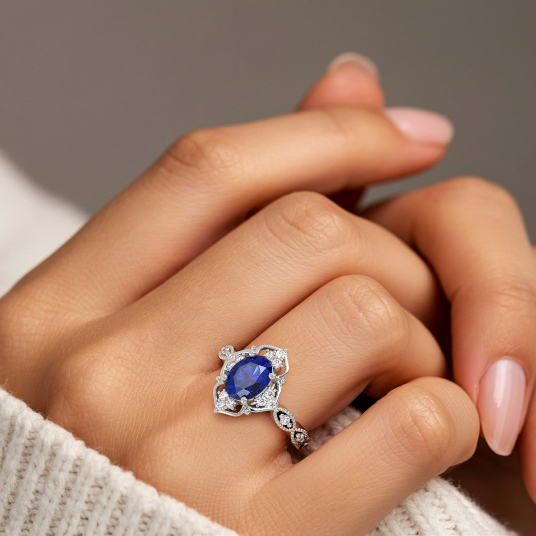 Oval gemstone with diamond cluster in vintage inspired ring setting, milgrain eternity band.