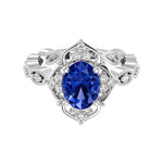 Antique oval blue sapphire and diamod ring white gold