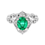 Antique oval colombian emerald and diamod ring white gold