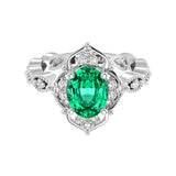 Antique oval colombian emerald and diamod ring white gold