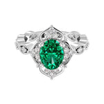 Antique oval emerald and diamod ring white gold