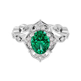 Antique oval emerald and diamod ring white gold