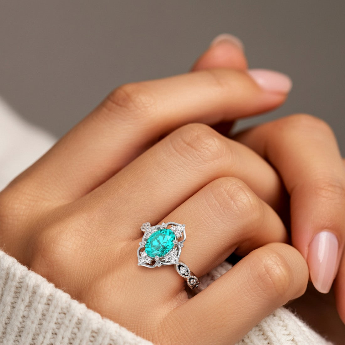 Oval gemstone with diamond cluster in vintage inspired ring setting, milgrain eternity band.