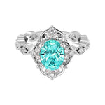 Antique oval paraiba tourmaline and diamod ring white gold