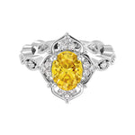 Antique oval yellow sapphire and diamod ring white gold
