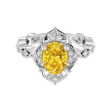 Antique oval yellow sapphire and diamod ring white gold