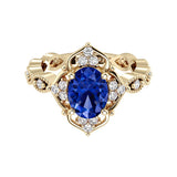 Oval cut vintage blue sapphire and diamond ring in yellow gold