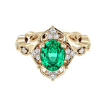 Oval cut vintage colombian emerald and diamond ring in yellow gold
