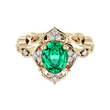 Oval cut vintage colombian emerald and diamond ring in yellow gold