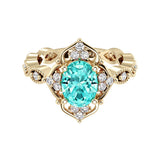 Oval cut vintage paraiba tourmaline and diamond ring in yellow gold