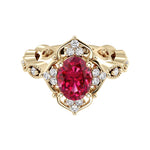 Oval cut vintage ruby and diamond ring in yellow gold
