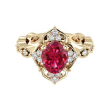 Oval cut vintage ruby and diamond ring in yellow gold