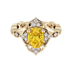 Oval cut vintage yellow sapphire and diamond ring in yellow gold