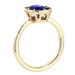 Luxury blue sapphire statement ring with illusion bezel setting and Taj Mahal inspired arches in 14K gold