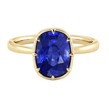 The Taj illusion bezel blue sapphire ring featuring a 3.50 carat cushion lab grown sapphire in 14K gold with Taj Mahal inspired arched gallery