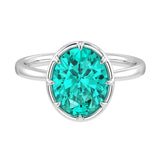 Oval Paraiba tourmaline solitaire bezel ring in 14K white gold with tapered band by Pel & Co – neon blue Paraiba tourmaline ring
