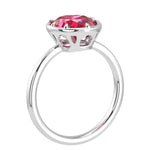Deep red oval ruby solitaire bezel ring with tapered white gold band – Pel & Co fine jewelry ruby ring
