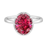 Oval ruby solitaire bezel ring in 14K white gold with tapered band by Pel & Co – luxury ruby engagement ring