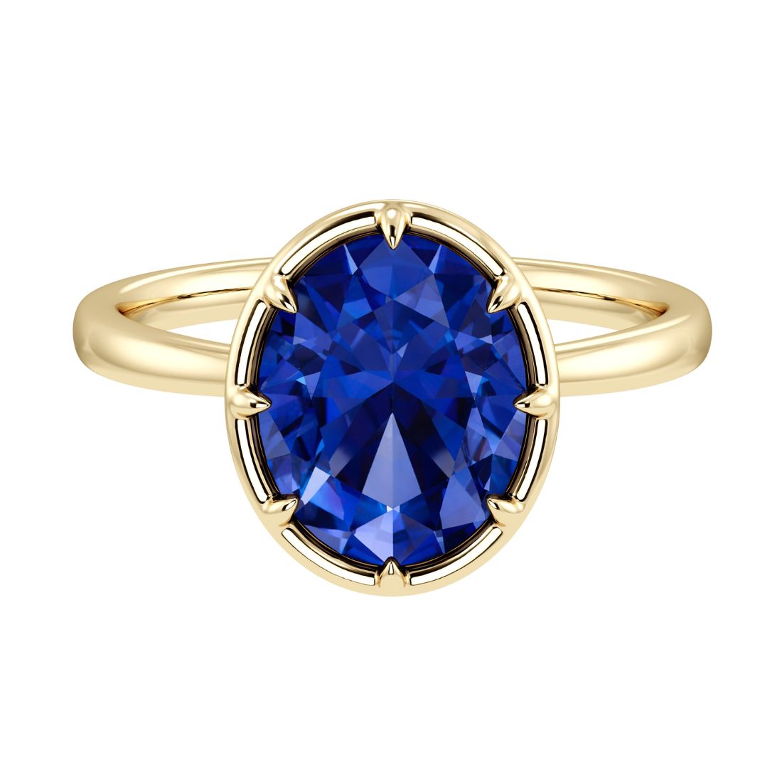 Luxury oval blue sapphire solitaire engagement ring by Pel & Co featuring bezel setting and tapered yellow gold band