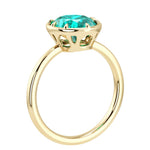 Luxury Paraiba tourmaline oval solitaire ring in polished yellow gold bezel setting with tapered band by Pel & Co