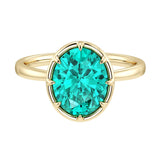 Elegant Paraiba tourmaline engagement ring with oval Paraiba center stone in bezel setting and tapered yellow gold band