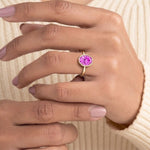 Timeless oval pink sapphire bezel set ring with tapered gold band – Pel & Co pink sapphire engagement ring