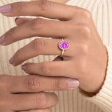 Timeless oval pink sapphire bezel set ring with tapered gold band – Pel & Co pink sapphire engagement ring