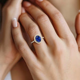 Close up oval blue sapphire ring with french pavé setting, fine jewelry handcrafted 14k gold
