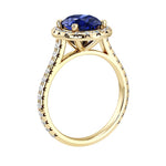 Profile of blue sapphire pavé diamond ring, elegant oval gemstone engagement ring design