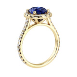 Profile of blue sapphire pavé diamond ring, elegant oval gemstone engagement ring design