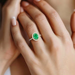 Close up oval emerald ring with french pavé setting, fine jewelry handcrafted gold emerald ring