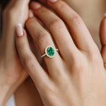 Close up oval emerald ring with diamond pavé band, fine jewelry emerald ring handcrafted