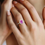 Close up pink sapphire ring with diamond pavé band, fine jewelry oval pink gemstone ring