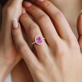 Close up pink sapphire ring with diamond pavé band, fine jewelry oval pink gemstone ring