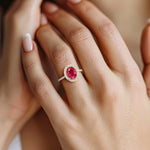 Close up ruby ring with diamond pavé band, fine jewelry oval red gemstone ring