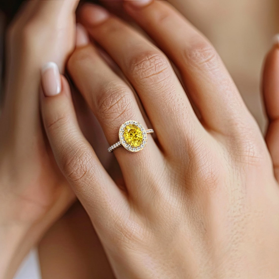 Close up yellow sapphire ring with diamond pavé band, fine jewelry oval gemstone ring