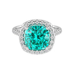 Sparkling neon blue green Paraiba tourmaline French Pave Diamond Halo crafted in 14K White Gold halo ring Pel and Co custom fine jewelry