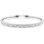 White gold ring with small diamonds on a white background