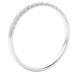 White gold ring with small diamonds on a white background