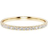 Gold ring with small diamonds on a white background