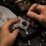 High jewelry jeweler hand-setting luxury diamonds and rare gemstones on an intricate custom fine jewelry piece by Pel & Co. Expert craftsmanship featuring bespoke jewelry design, diamond setting, gemstone sourcing, and handcrafted high jewelry made in Los Angeles, USA.
